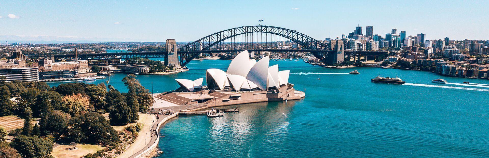Sydney harbour Sydney harbour on a clear day, with the Opera House in the foreground and the Harbour Bridge behind it.