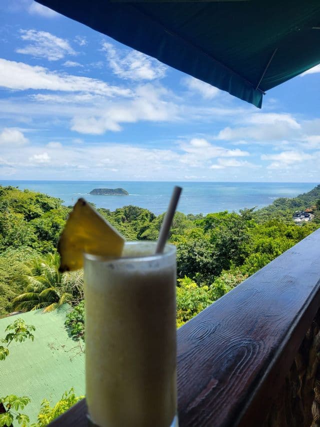Sunset drink in Manuel Antonio Cocktail with a view over the Pacific coast of Manuel Antonio, Costa Rica