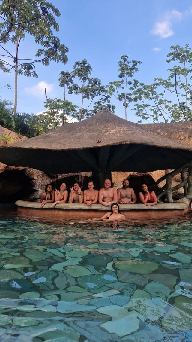 Volcanic hot springs in La Fortuna Travelers relaxing in the volcanic hot spring pools of La Fortuna, Costa Rica