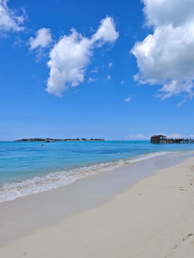Turquoise water lapping a white sand beach in the Bahamas
