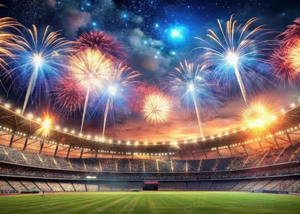 Colorful fireworks exploding in a starry night sky over a crowded and brightly lit sports stadium.