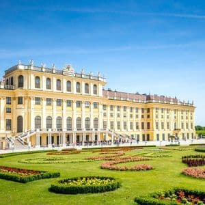 Schoenbrunn Palace in Vienna behind its formal flower beds.