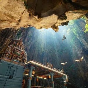 An ornate temple built inside a large cave, with sunbeams shining down from an opening as birds fly past.