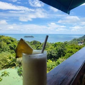 Sunset drink in Manuel Antonio Cocktail with a view over the Pacific coast of Manuel Antonio, Costa Rica