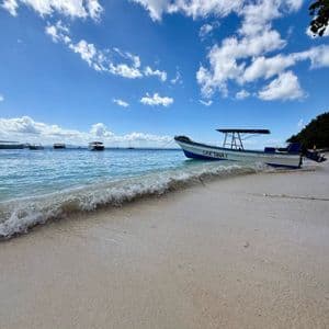 Beach in Bocas del Toro Boat moored off a sandy beach in Bocas del Toro, Panama