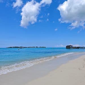Turquoise water lapping a white sand beach in the Bahamas