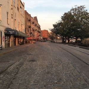 River Street at dusk, Savannah (photo Seasider53, CC BY-SA 4.0, Wikimedia Commons) Cobblestone River Street in Savannah at dusk with old warehouses.