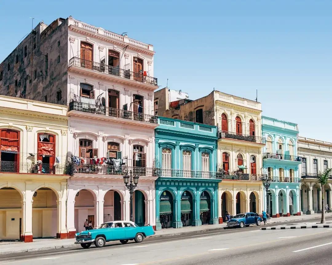 Colorful colonial buildings and a vintage car in Havana, Cuba